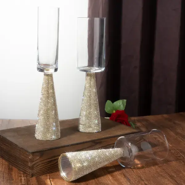 Champagne flutes with crystal-filled decorative stems