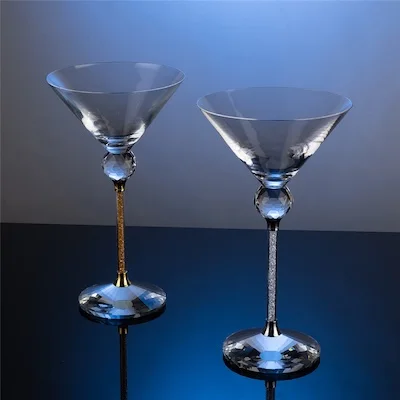 Two cocktail glasses with crystal and metal stems